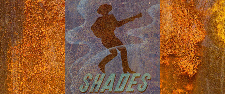 Ohrenschmaus mit Patina: Shades von J.J. Cale Ein rostiger Hintergrund, davor leicht transparent das Plattencover von Shades.